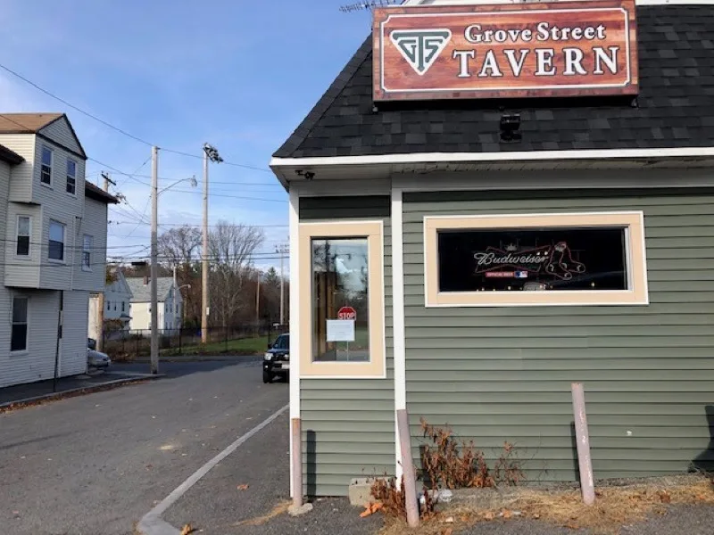 Street view of the Grove Street Tavern building and sign